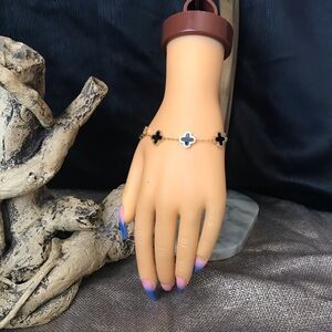 clover charm bracelet black & gold